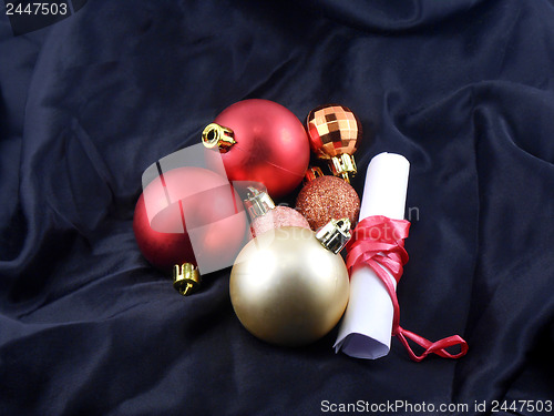 Image of christmas balls with white paper, red gift bow