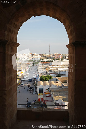 Image of 	El Djem, City skyline through the arches of amphitheatre