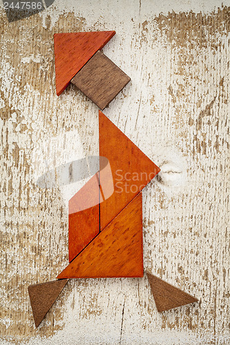 Image of tangram walking woman figure