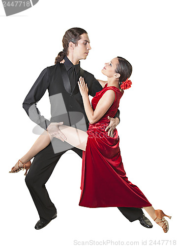 Image of Young couple dancing tango
