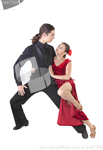 Image of Young couple dancing tango