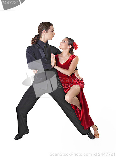 Image of Young couple dancing tango