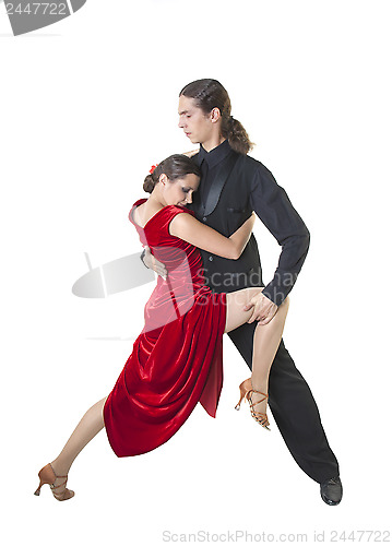 Image of Young couple dancing tango