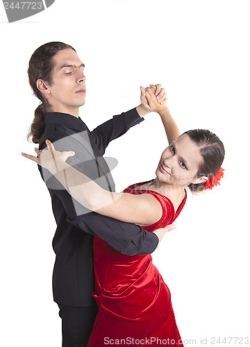Image of Young couple dancing waltz