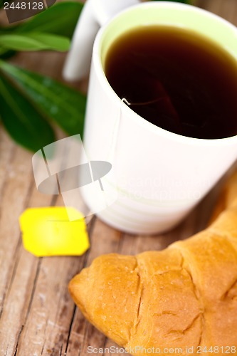 Image of cup of tea and fresh croissant