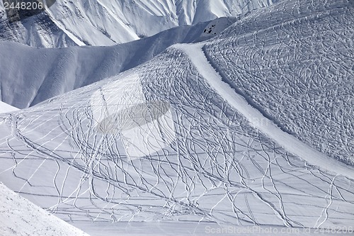 Image of Off-piste and groomed slope with trace from ski and snowboards