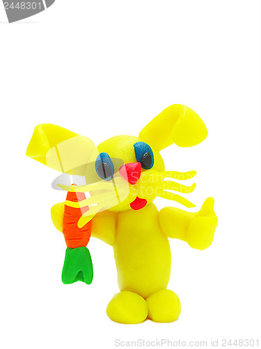 Image of Yellow plasticine rabbit with carrot