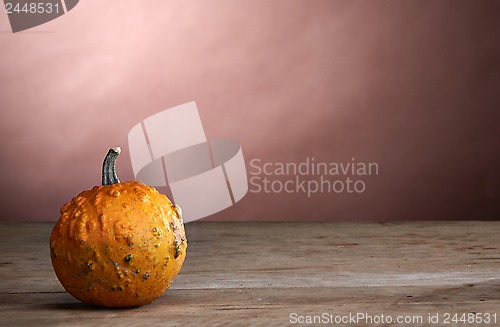 Image of pumpkin on old wooden table