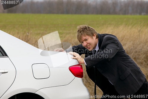 Image of Pushing car