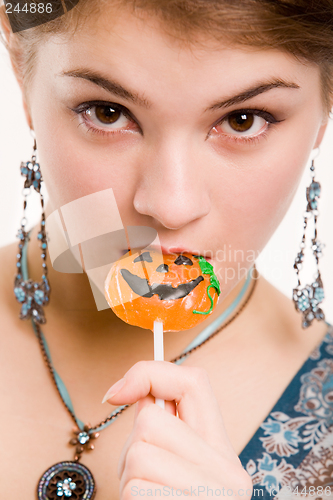 Image of Girl sucking the sugar pumpkin