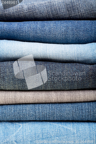 Image of stack of blue jeans background