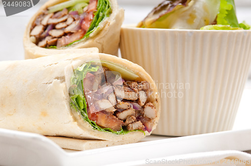 Image of kafta shawarma chicken pita wrap roll sandwich