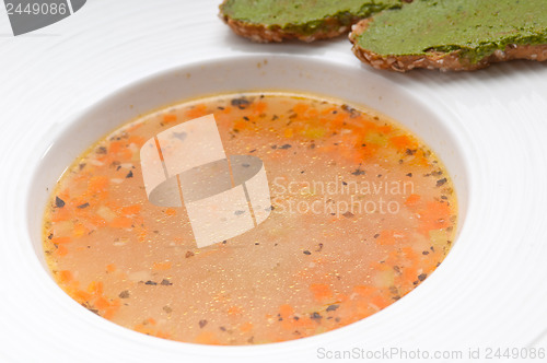 Image of Italian minestrone soup with pesto crostini on side