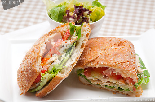 Image of ciabatta panini sandwich with chicken and tomato