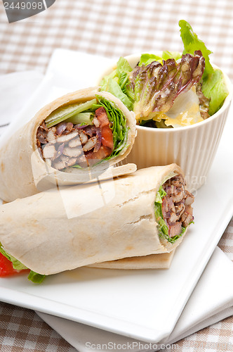 Image of kafta shawarma chicken pita wrap roll sandwich