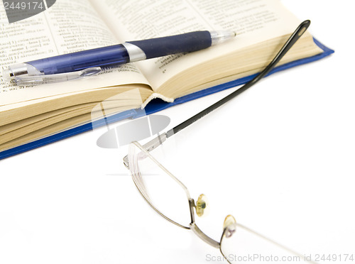 Image of book and glasses