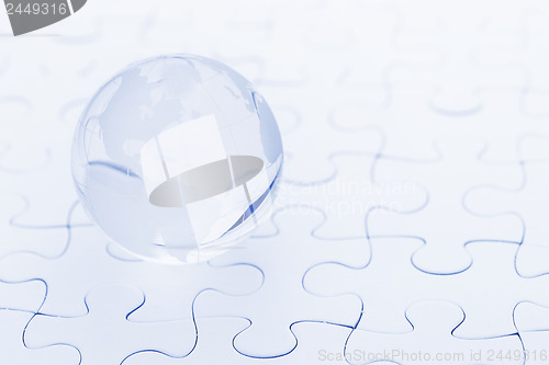 Image of Glass globe ball on puzzle