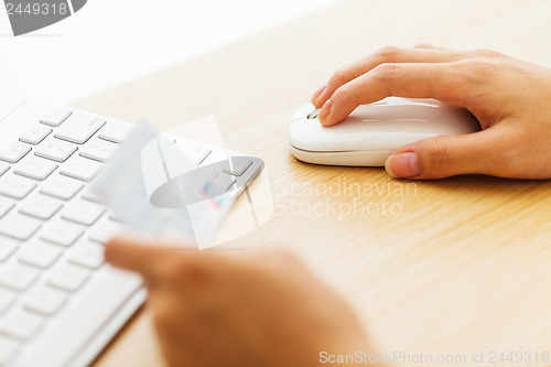 Image of Online shopping with credit card and keyboard