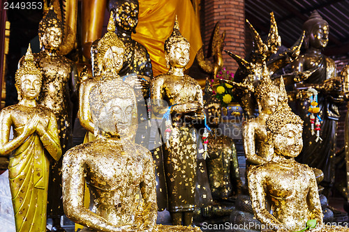 Image of Buddha statue with gold foil in temple