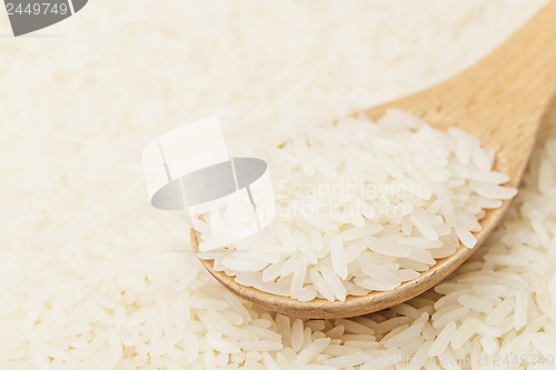 Image of White rice on teaspoon