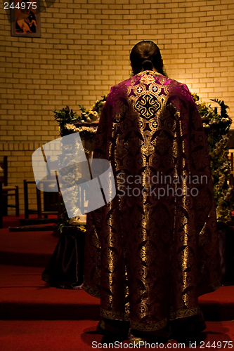 Image of priest in the altar