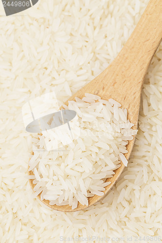 Image of White rice and teaspoon