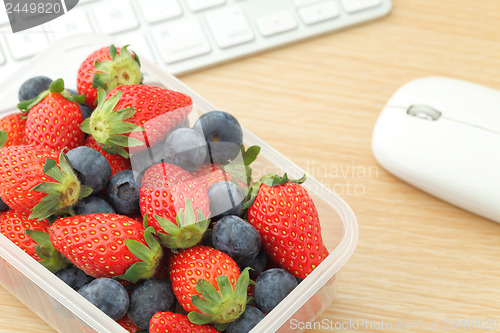 Image of Berry mix lunch box in working desk