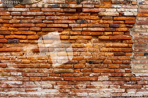 Image of Ancient brick wall in red color