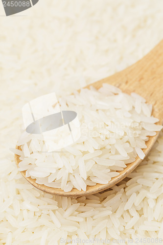 Image of White rice on teaspoon