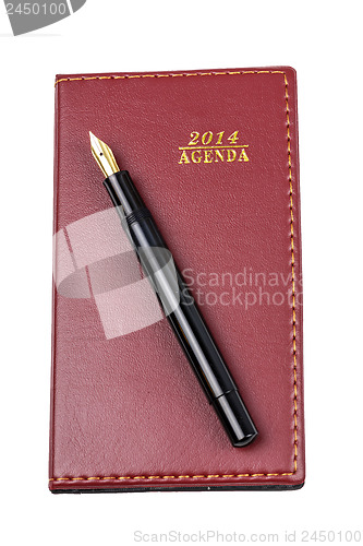 Image of Leather notebook and pen isolated 