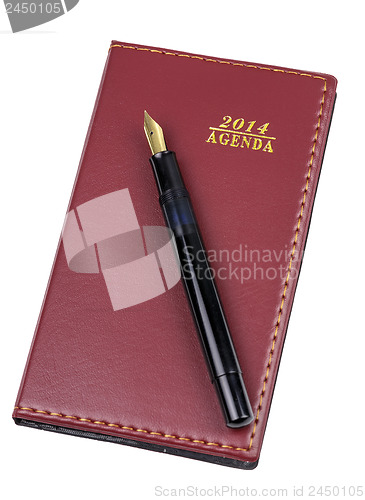 Image of Leather notebook and pen isolated 