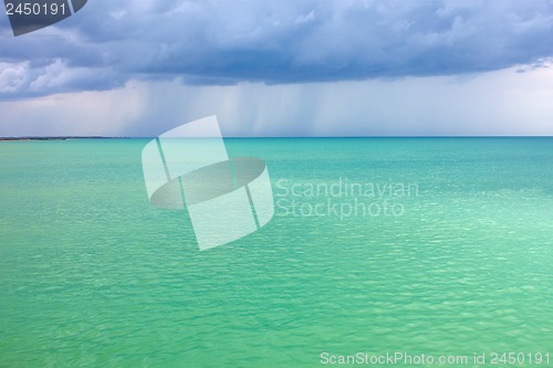 Image of Storm clouds over the turquoise sea