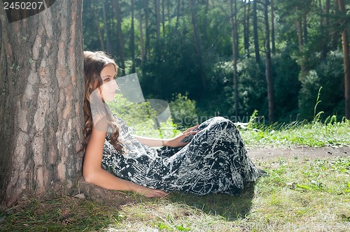 Image of Pretty girl under tree