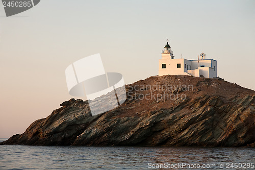 Image of lighthouse on rocky island