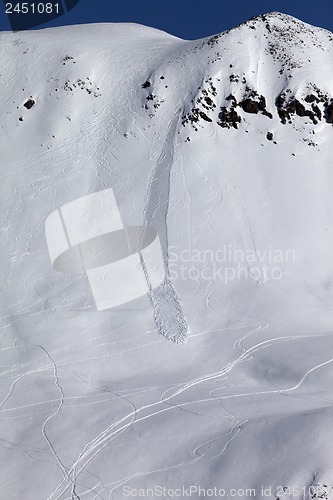 Image of Off piste slope with trace of skis, snowboarding and avalanche