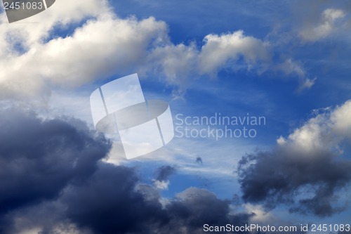 Image of Blue sky with sunlight and storm clouds