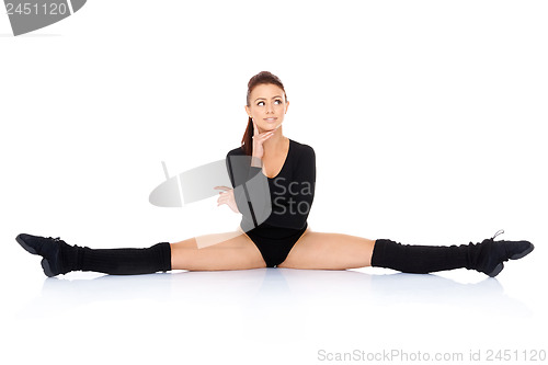 Image of Supple woman doing the splits