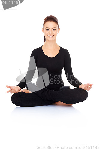 Image of Beautiful woman meditating in the lotus position