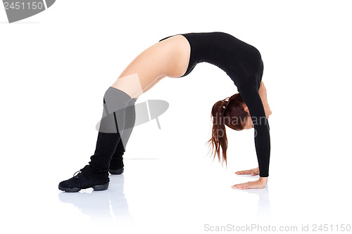 Image of Athletic supple woman arching her back