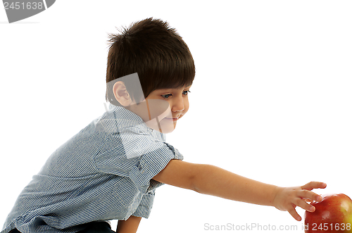 Image of Little Boy Reaching for Apple