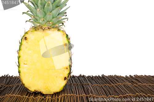 Image of Sliced pineapple on wooden table