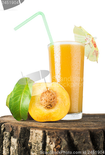 Image of Peaches and glass with juice.