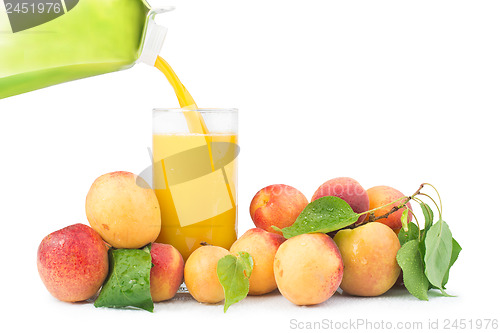 Image of Apricots and glass juice. 