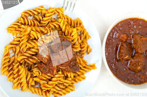 Image of fusilli pasta with neapolitan style ragu meat sauce