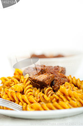 Image of fusilli pasta with neapolitan style ragu meat sauce