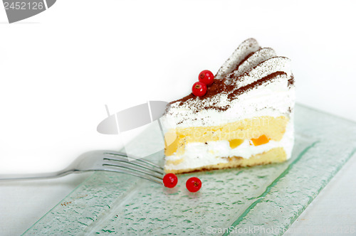 Image of whipped cream and ribes dessert cake slice