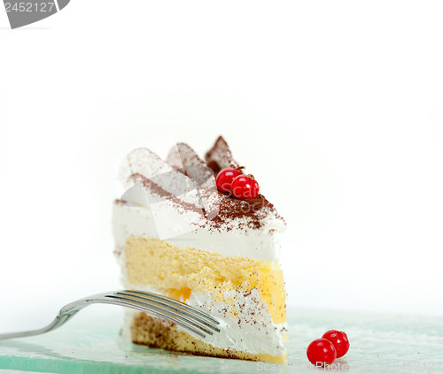 Image of whipped cream and ribes dessert cake slice