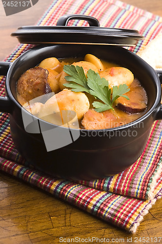 Image of Beans with sausage, bacon and tomatoes