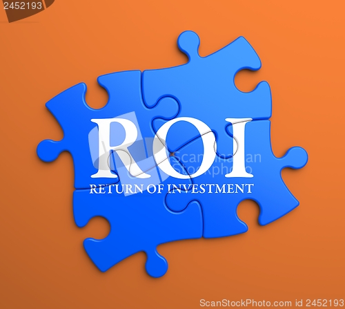 Image of ROI on Blue Puzzle Pieces. Business Concept.