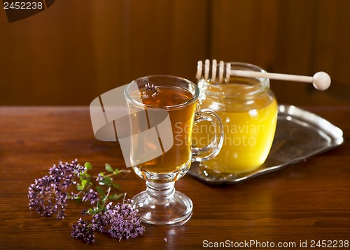 Image of Still life from medicinal herbs, honey, herbal tea